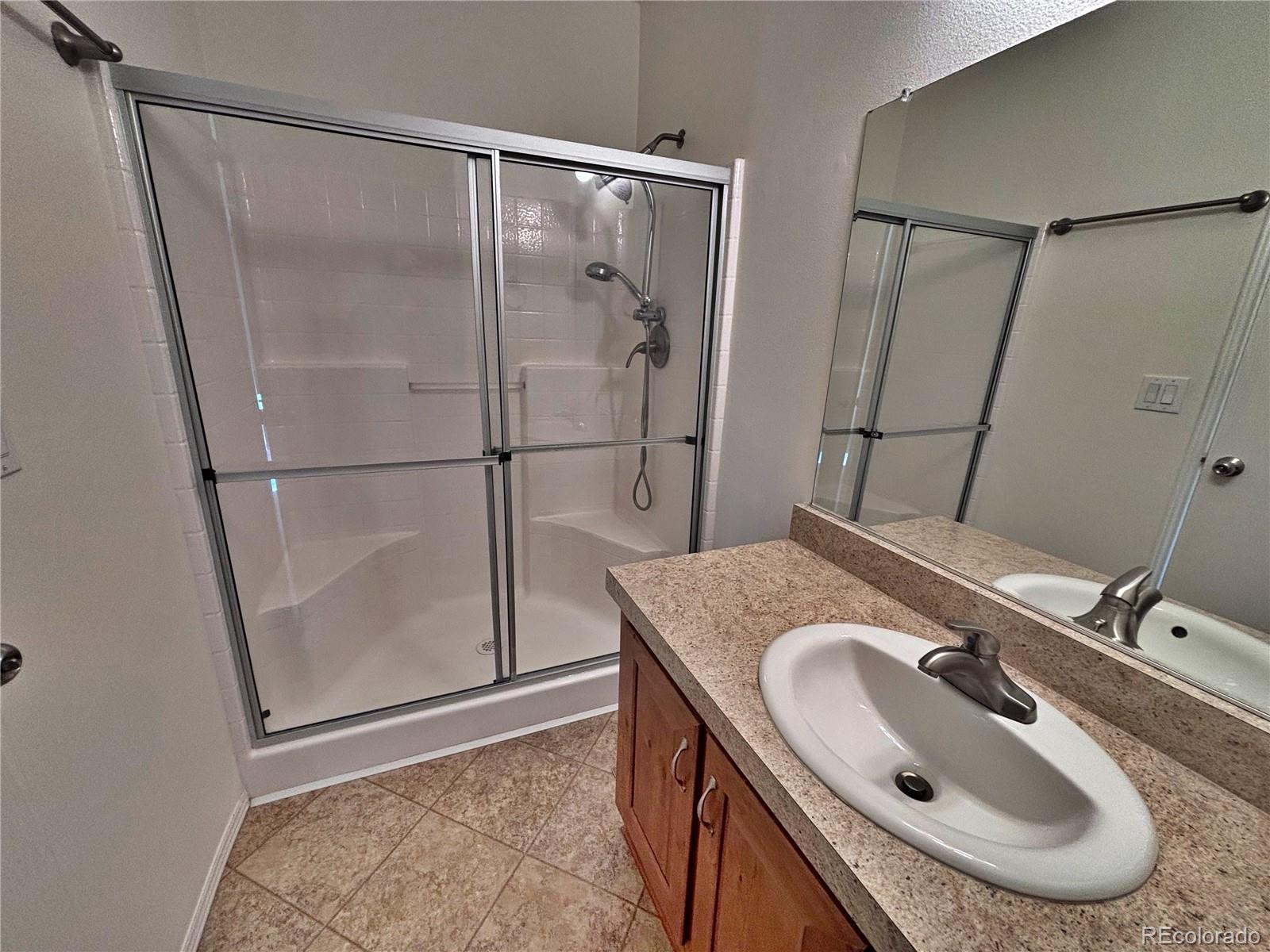 155 A Street Golden, CO 80401 - Photo 42 of 49 a bathroom with a sink and a granite countertop sink