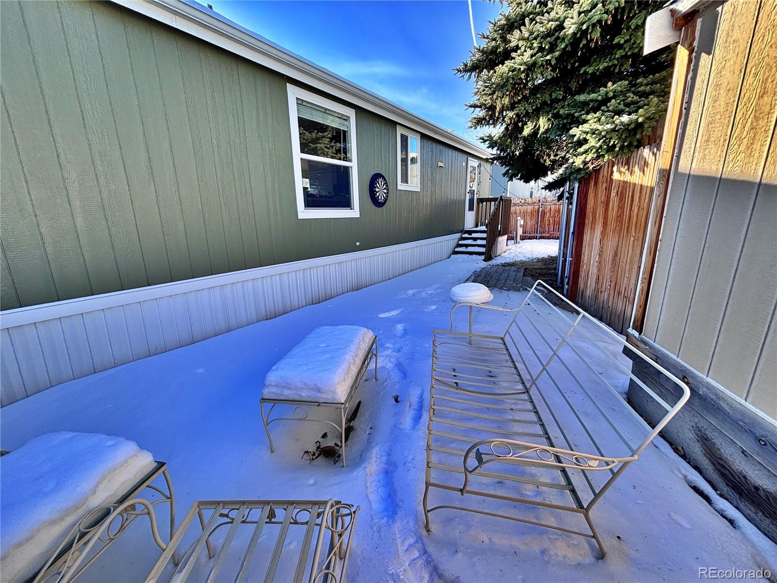 155 A Street Golden, CO 80401 - Photo 45 of 49 a view of a deck with wooden floor and furniture