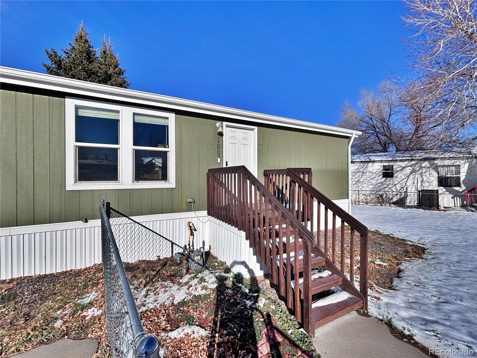 155 A Street Golden, CO 80401 - Photo 6 of 49 a view of a house with wooden deck front of house