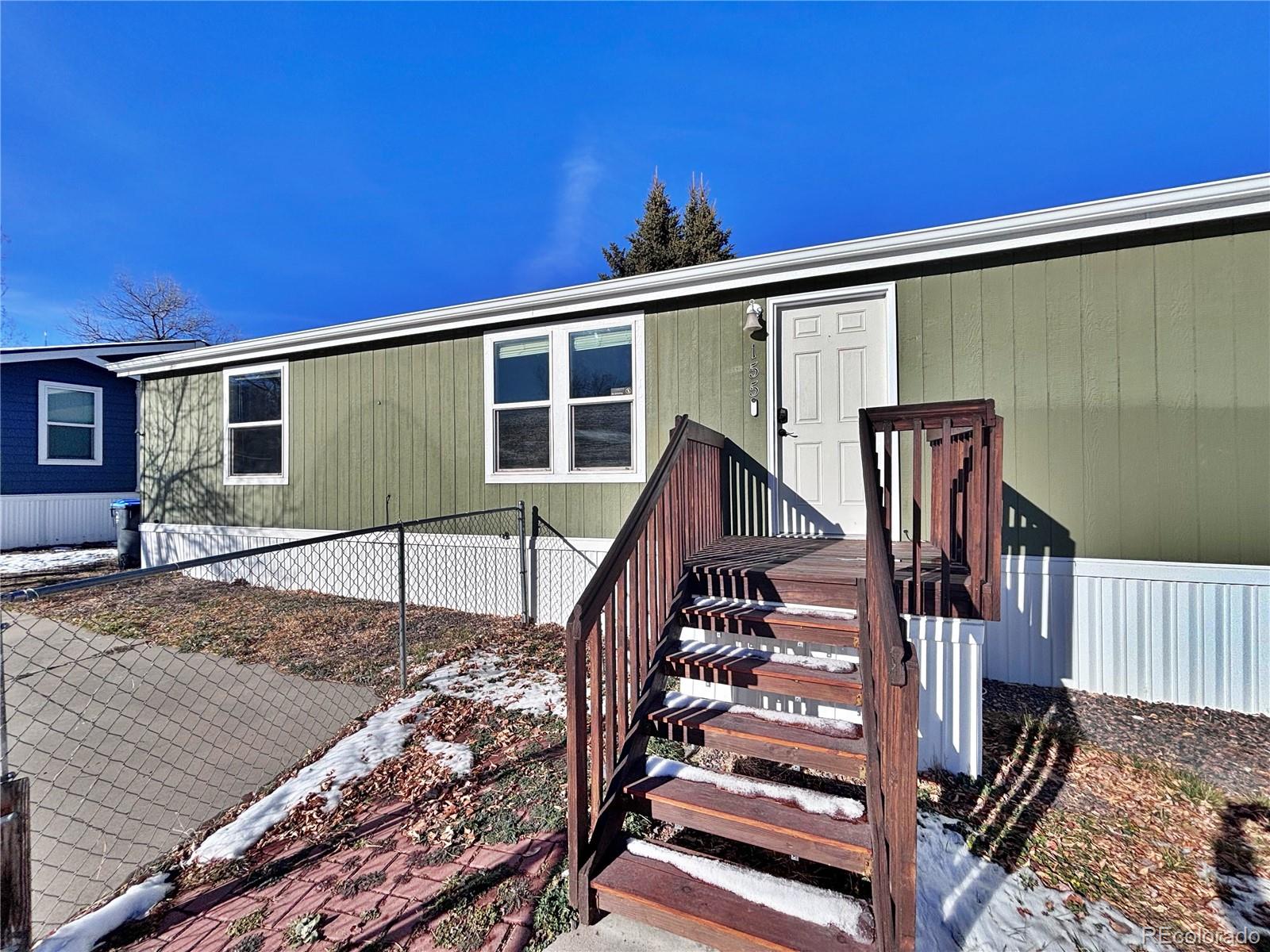 155 A Street Golden, CO 80401 - Photo 7 of 49 a view of a house with wooden stairs and a floor to ceiling window