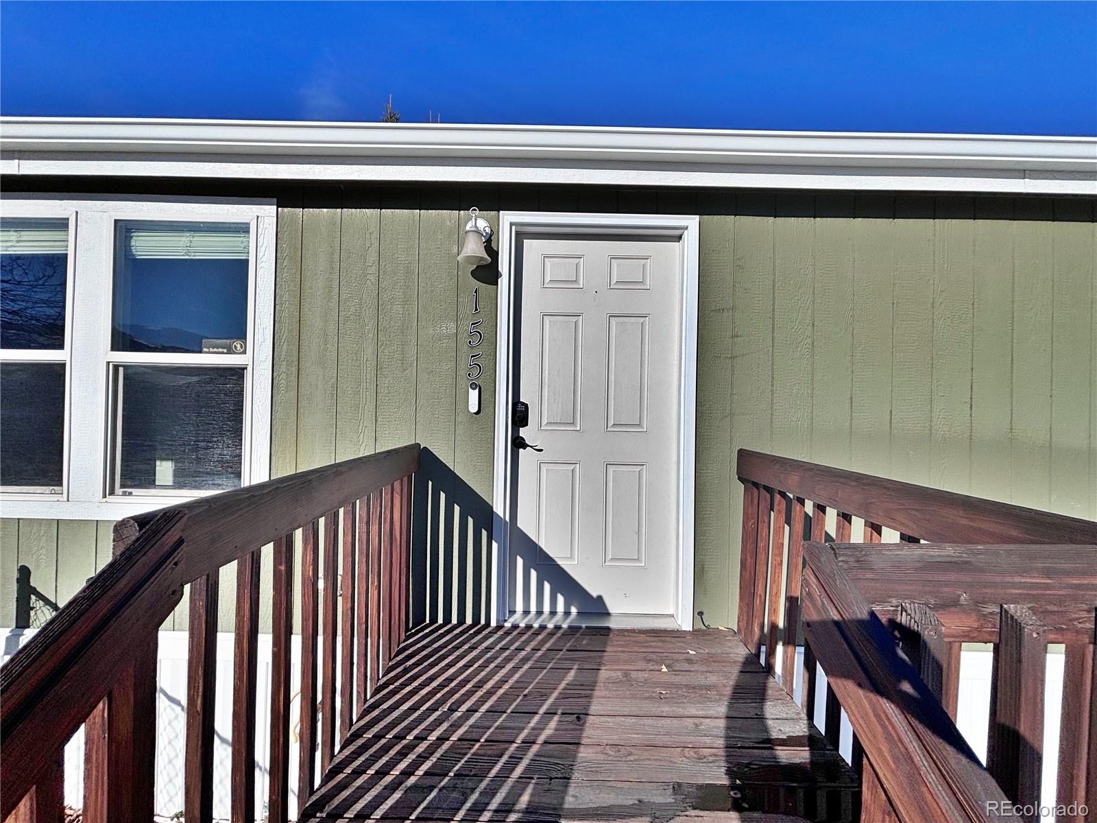 155 A Street Golden, CO 80401 - Photo 8 of 49 a view of a balcony with wooden floor and stairs