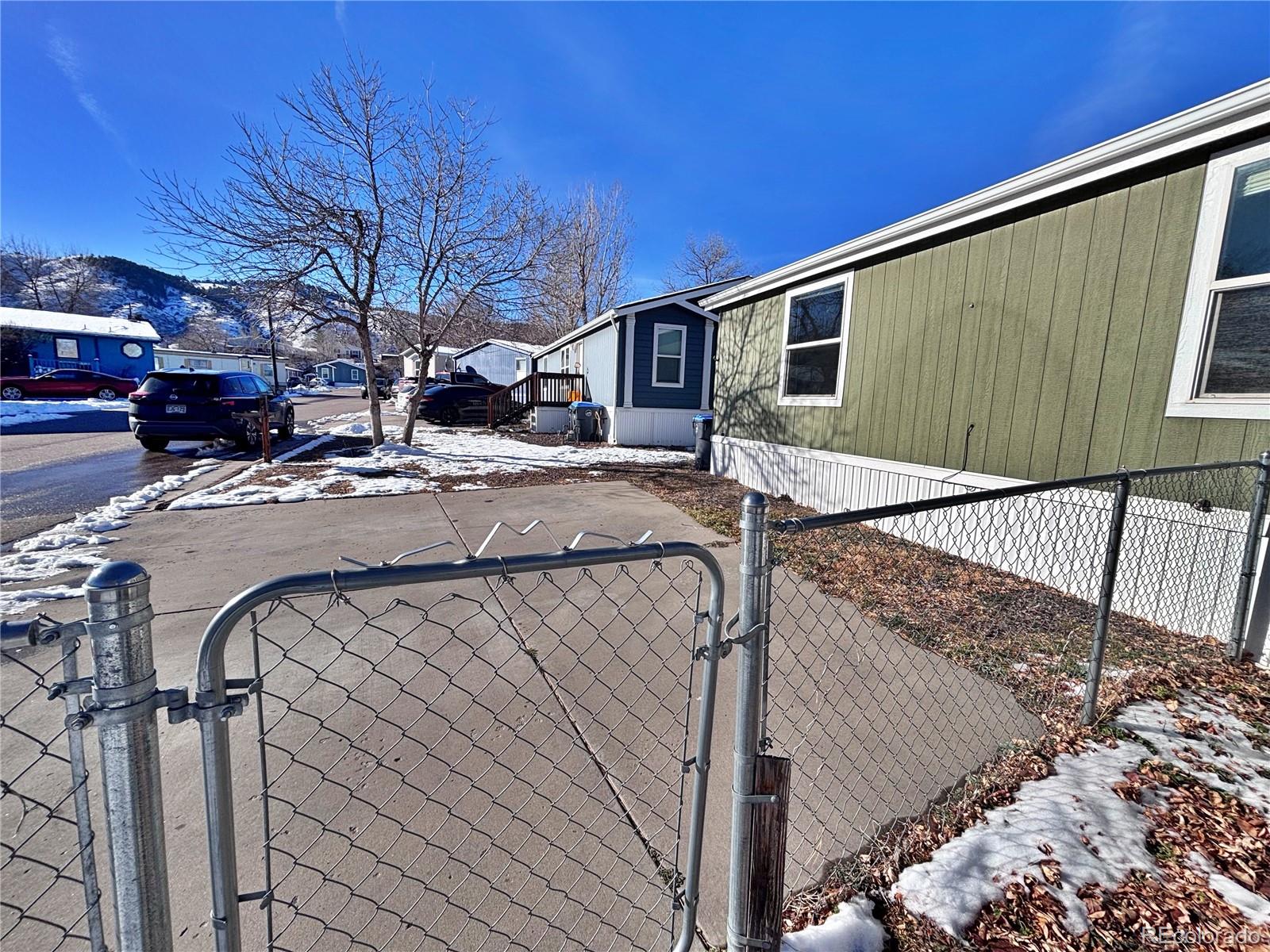 155 A Street Golden, CO 80401 - Photo 9 of 49 a view of a house with a snow on the road