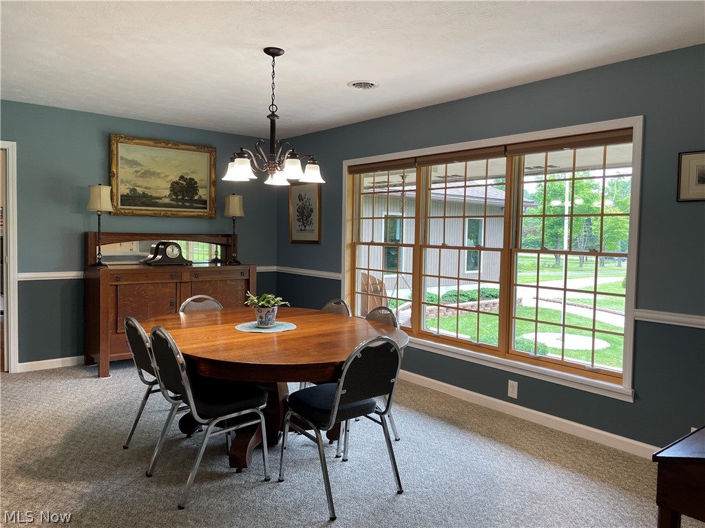 12709 Ravenna Road Chardon, OH 44024 - Photo 13 of 35 Dining Room with picture window with views of the beautiful yard.