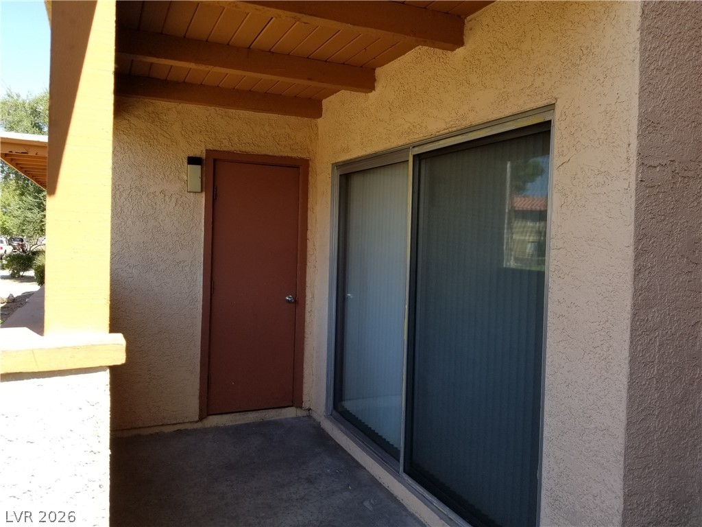 1515 East Reno Avenue, Unit A103 Las Vegas, NV 89119 - Photo 4 of 16 Step out onto this shaded outdoor patio with direct access to a private entrance.