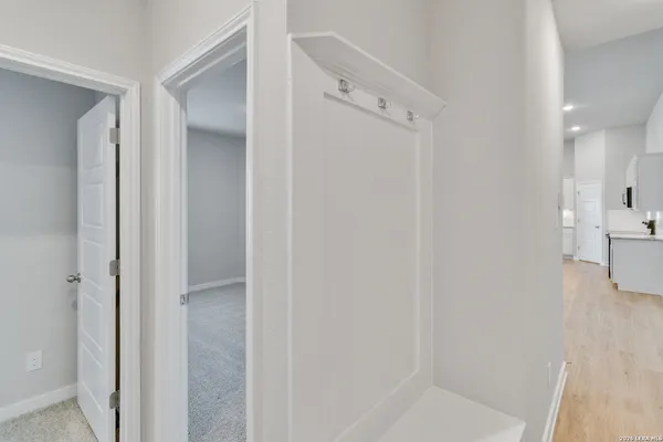 a bathroom with a shower and a glass door