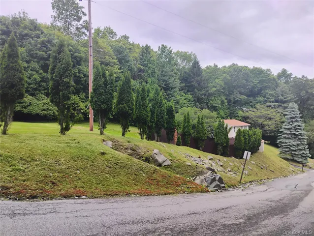 a living room with furniture wooden floor and a large window