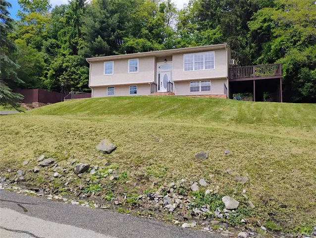 a view of a house with a yard