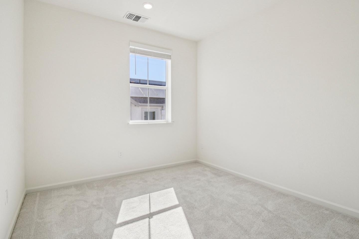 3769 Castro Valley Boulevard Castro Valley, CA 94546 - Photo 18 of 33 an empty room with a exposed radiator and window