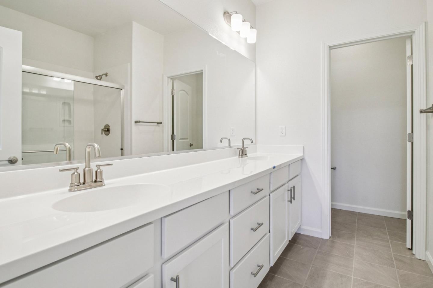 3769 Castro Valley Boulevard Castro Valley, CA 94546 - Photo 26 of 33 a bathroom with double sink and a mirror