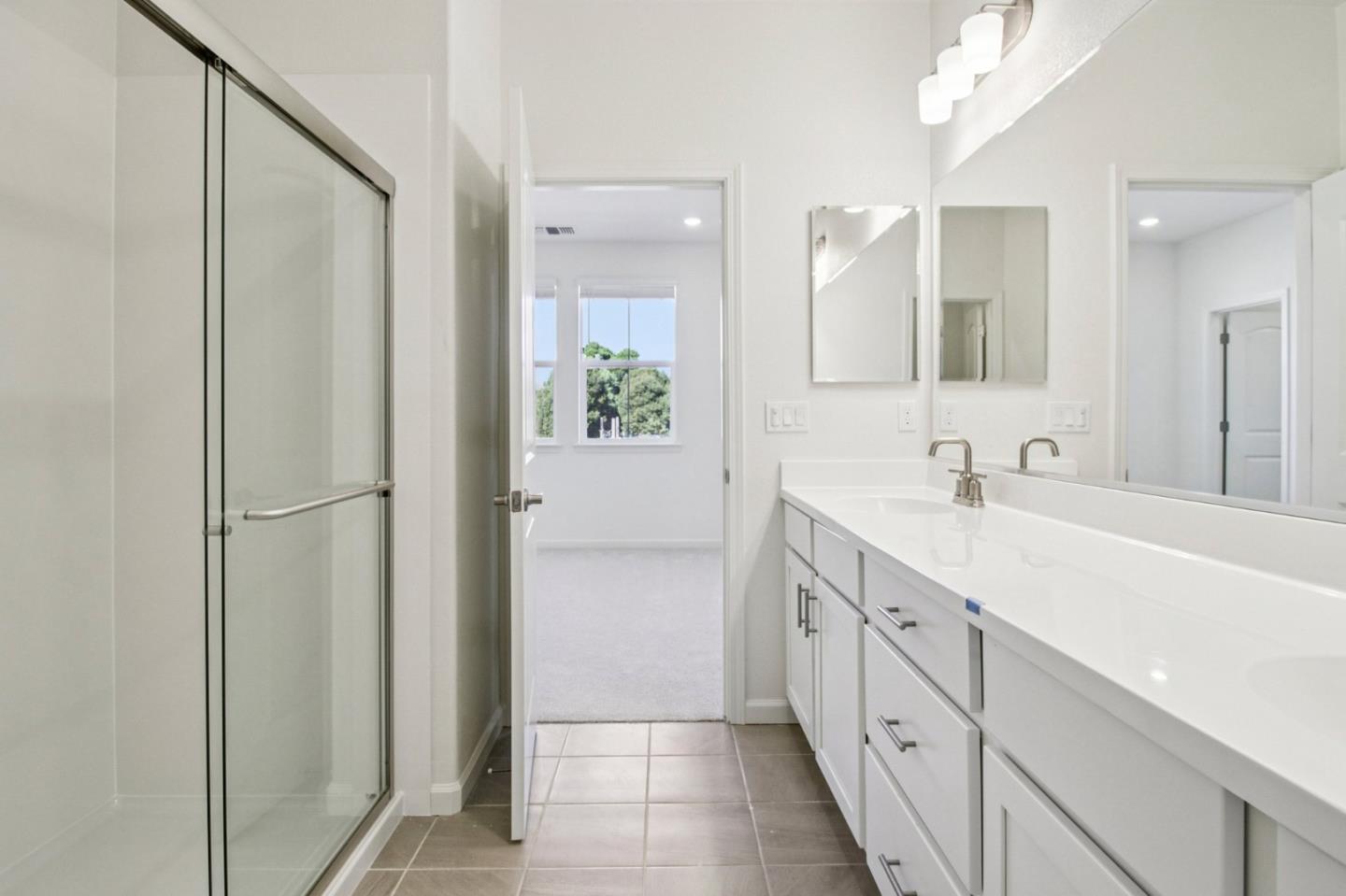 3769 Castro Valley Boulevard Castro Valley, CA 94546 - Photo 27 of 33 a spacious bathroom with a double vanity sink a mirror and a shower