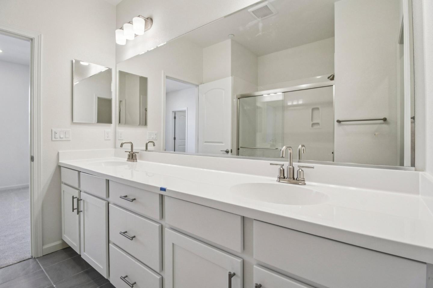 3769 Castro Valley Boulevard Castro Valley, CA 94546 - Photo 28 of 33 a bathroom with double sink and a mirror