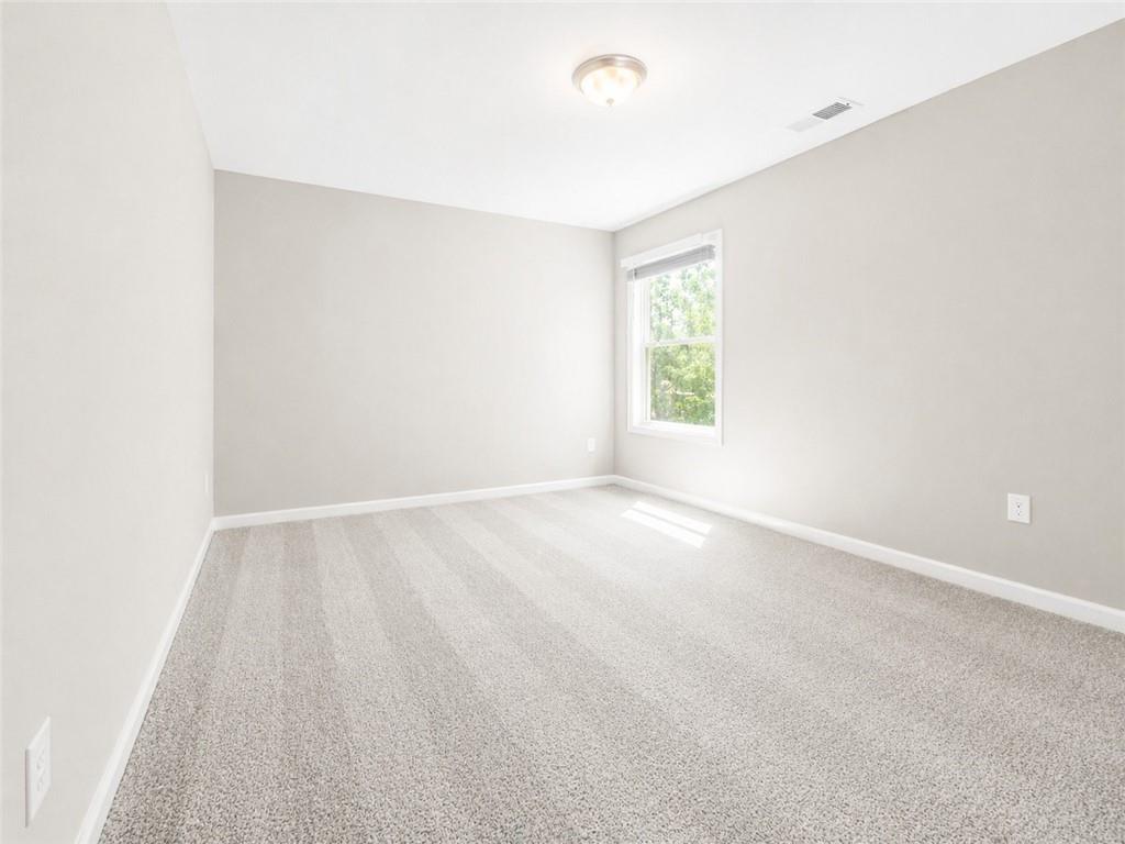 524 Rippling Court Temple, GA 30179 - Photo 11 of 19 an empty room with a window