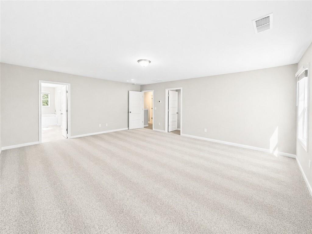 524 Rippling Court Temple, GA 30179 - Photo 12 of 19 a view of an empty room with wooden floor