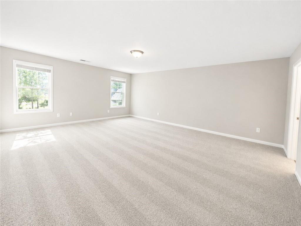 524 Rippling Court Temple, GA 30179 - Photo 13 of 19 an empty room with windows