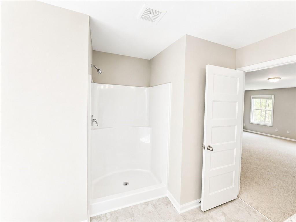 524 Rippling Court Temple, GA 30179 - Photo 17 of 19 a bathroom with a bathtub