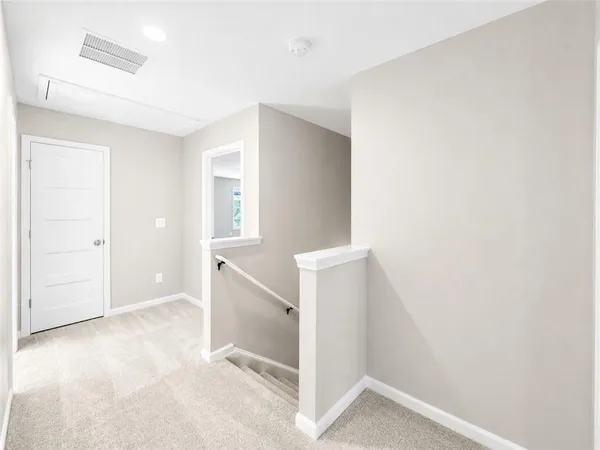 an empty room with closet area