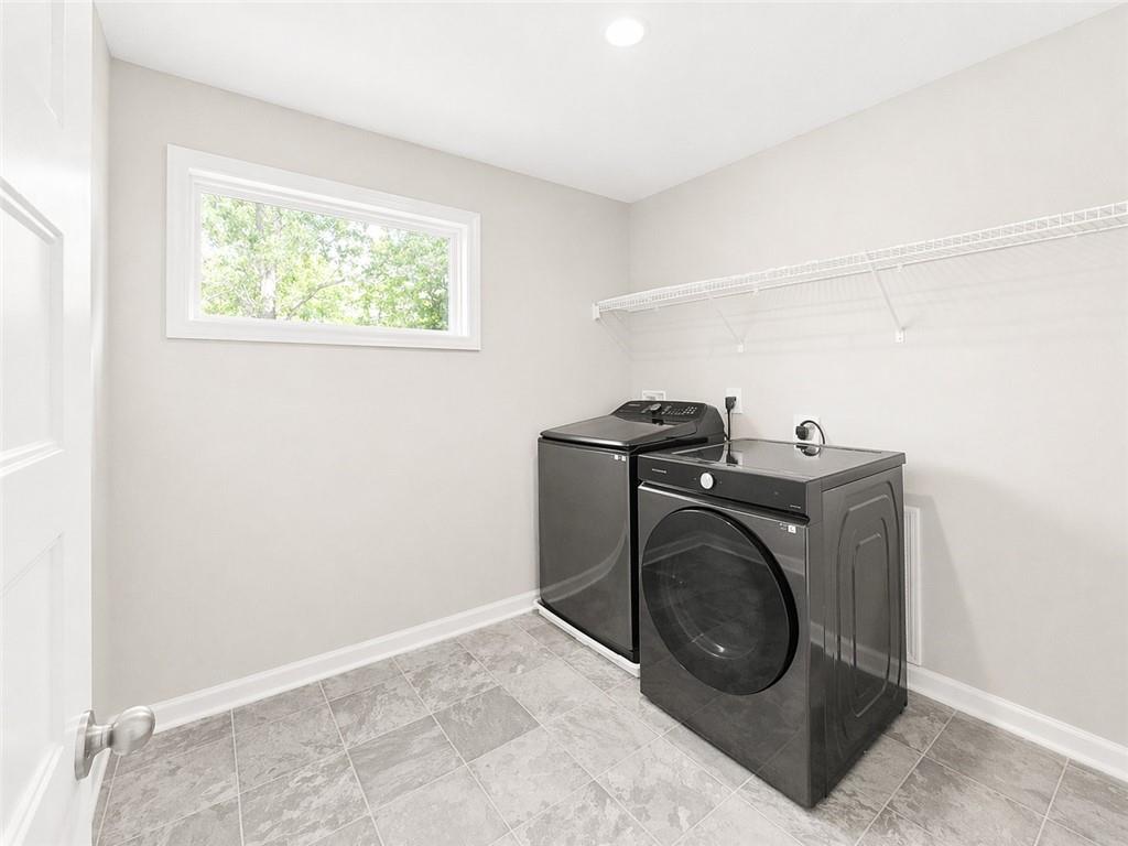 524 Rippling Court Temple, GA 30179 - Photo 8 of 19 a utility room with dryer and washer