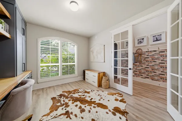 a view of a living room with furniture and a window