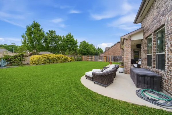 a view of a house with a yard porch and sitting area