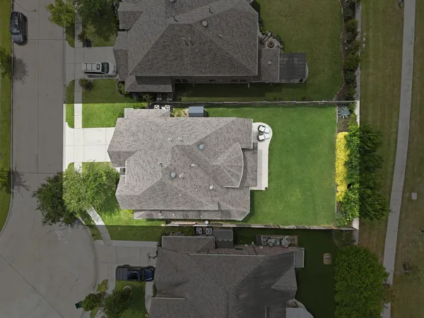 an aerial view of house with yard swimming pool and outdoor seating
