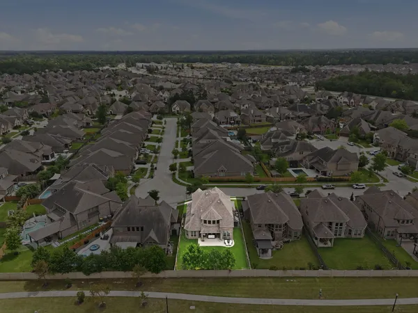 an aerial view of a house with a garden