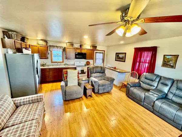 a living room with furniture and a flat screen tv
