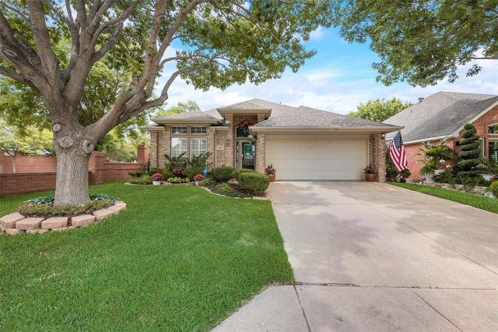 6416 Stone Creek Terrace Fort Worth, TX 76137 - Photo 1 of 1 a front view of a house with a garden and plants