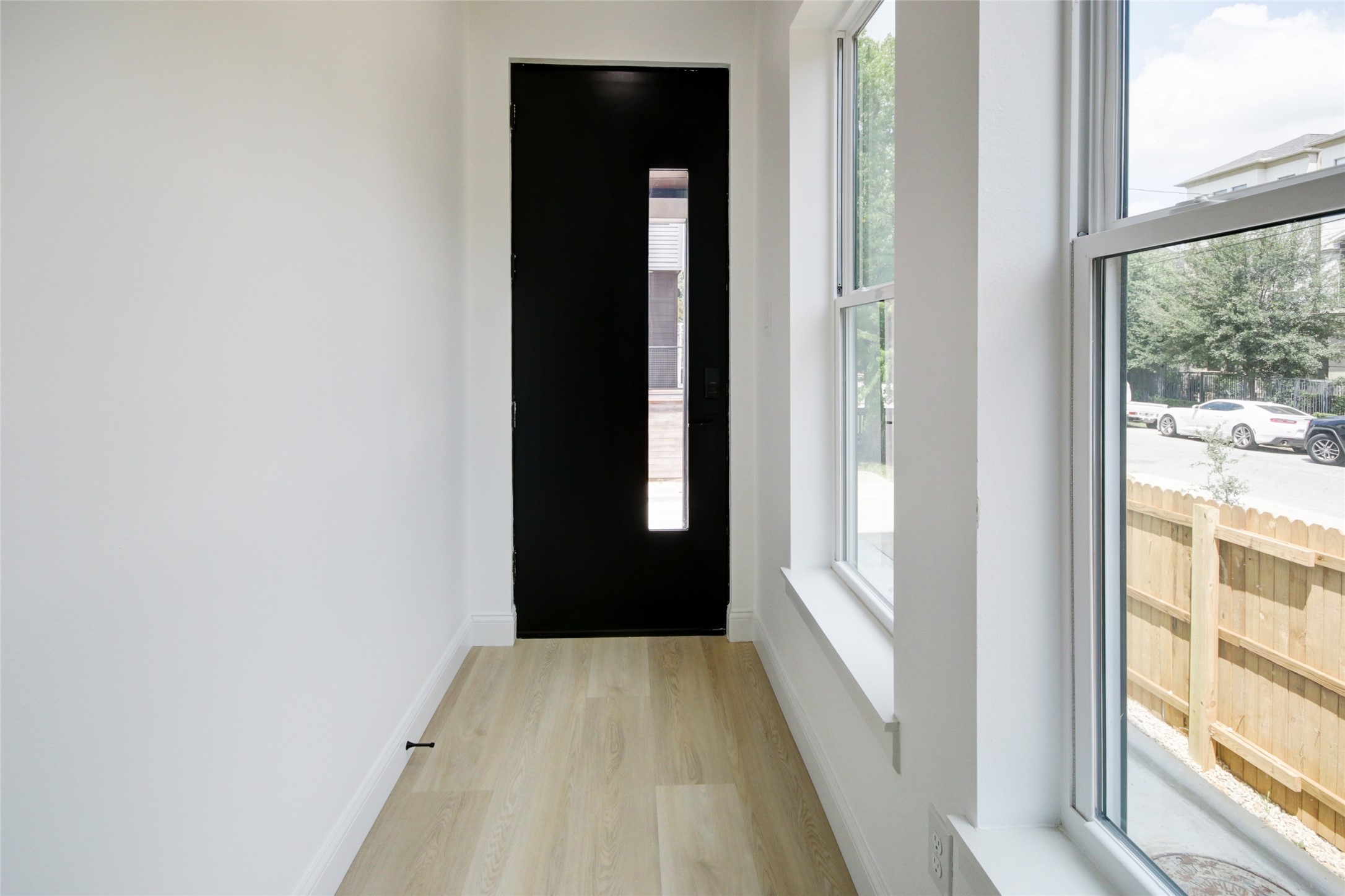 1214 West 24th Street, Unit D Houston, TX 77008 - Photo 4 of 45 a view of a bedroom from the hallway