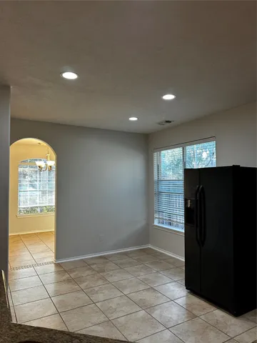 a view of an empty room and a window