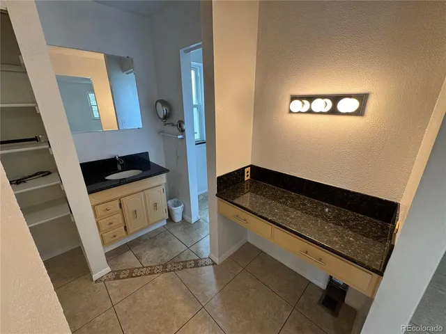 a bathroom with a glass door shower and toilet