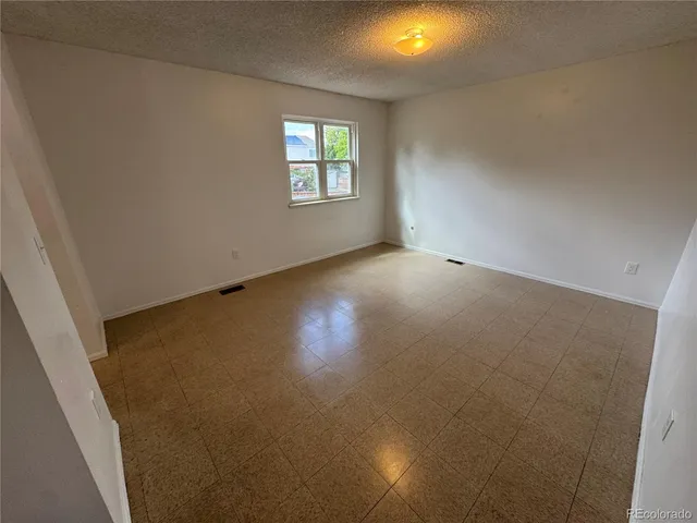 a bathroom with a granite countertop sink toilet a mirror and shower