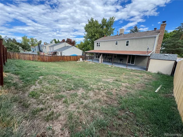 a view of backyard with green space