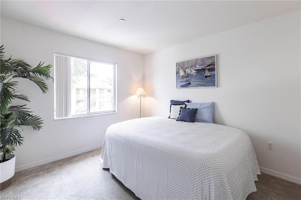 8274 Key Royal Circle, Unit 1036 Naples, FL 34119 - Photo 21 of 45 Bedroom with carpet