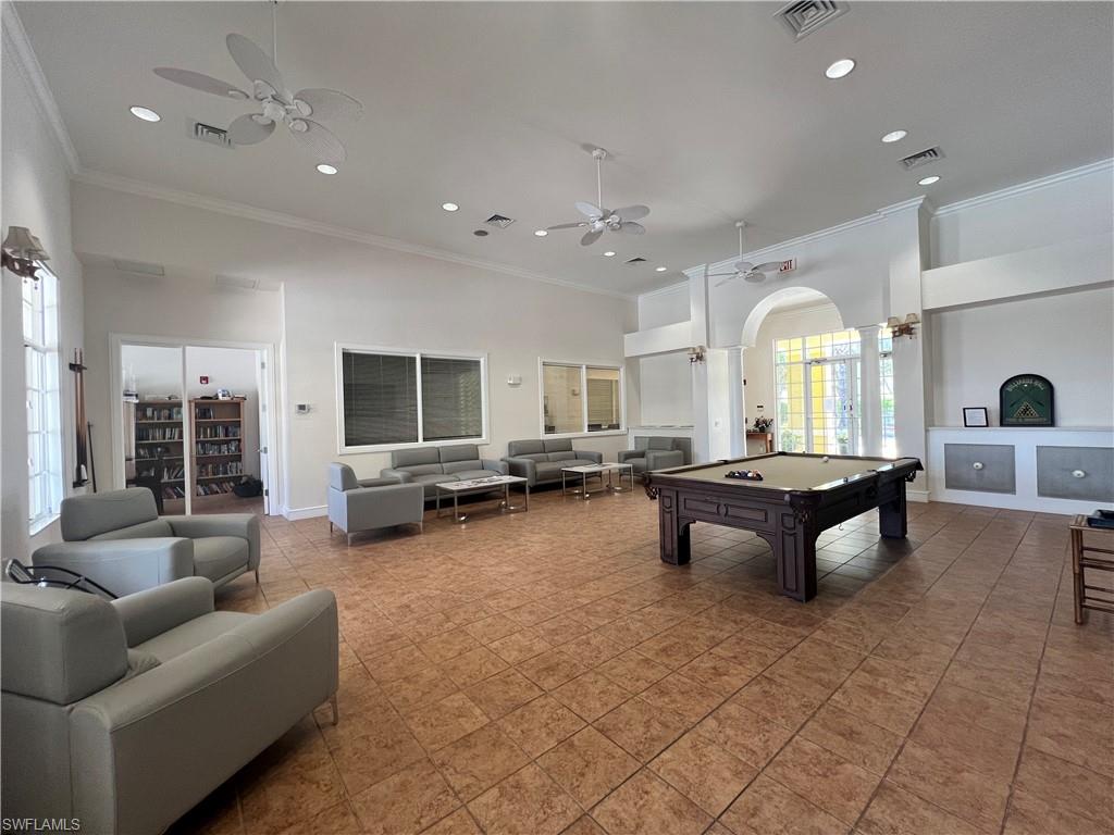 8274 Key Royal Circle, Unit 1036 Naples, FL 34119 - Photo 38 of 45 Rec room featuring crown molding, a towering ceiling, arched walkways, recessed lighting, and pool table