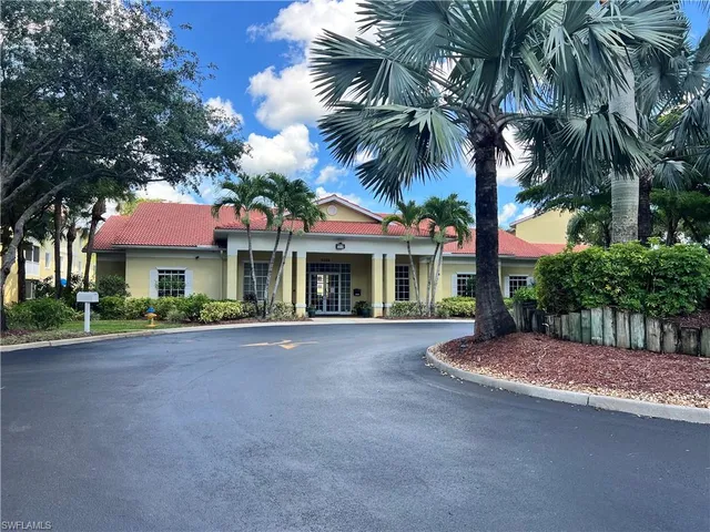 a view of a road with a house in the background