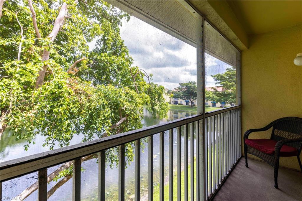 8274 Key Royal Circle, Unit 1036 Naples, FL 34119 - Photo 8 of 45 Balcony featuring a water view