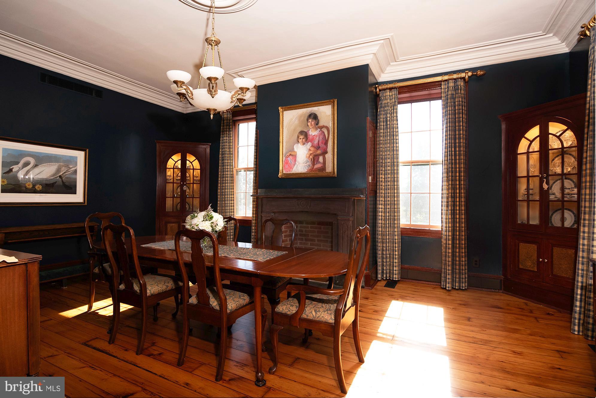 10121 Fairlee Road Chestertown, MD 21620 - Photo 13 of 66 a view of a dining room with furniture window and wooden floor