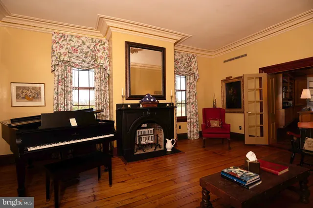 a kitchen with stainless steel appliances a refrigerator a stove a sink and a microwave