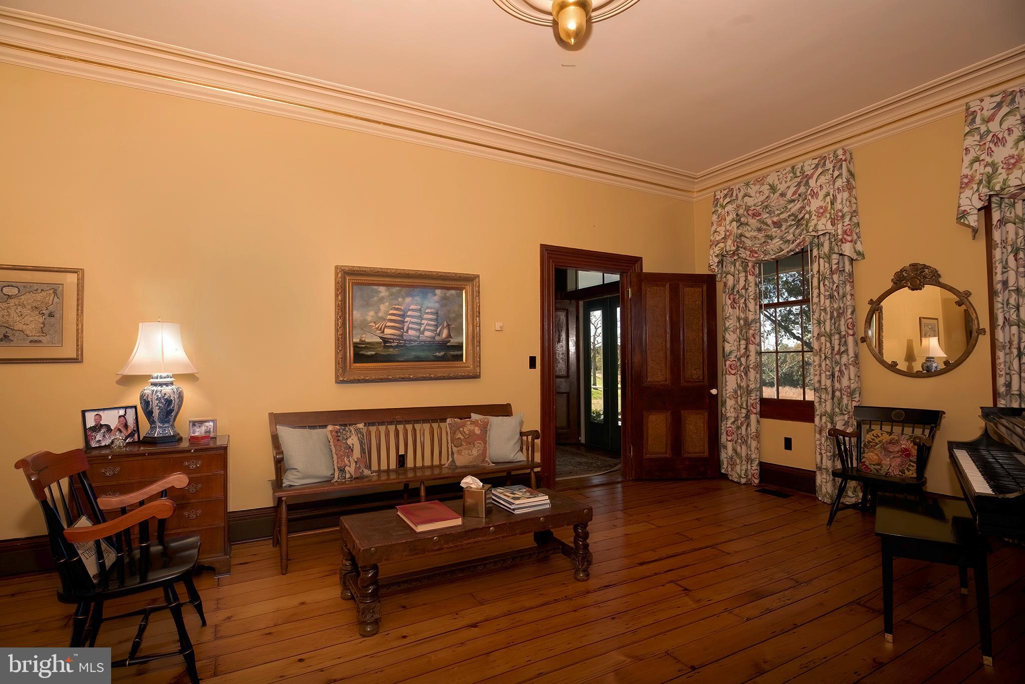10121 Fairlee Road Chestertown, MD 21620 - Photo 16 of 66 a living room with furniture and a wooden floor