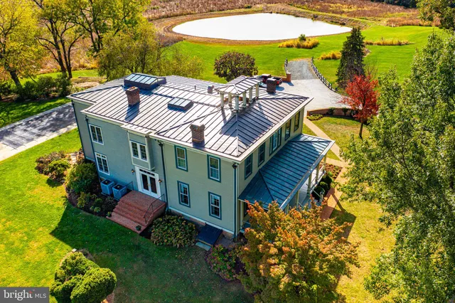 an outdoor space with furniture and garden