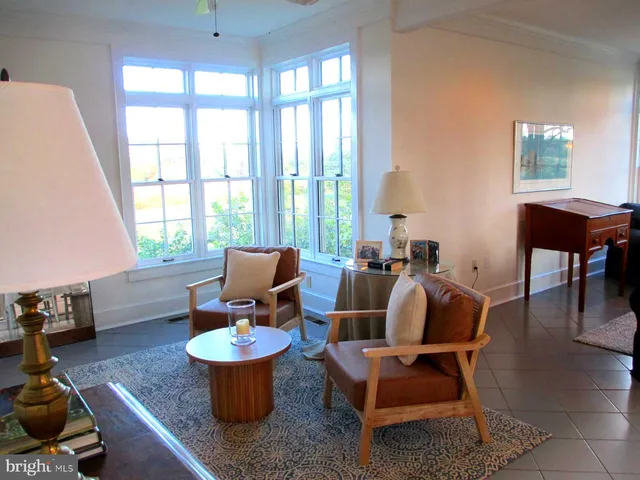 a view of a livingroom with furniture and front door