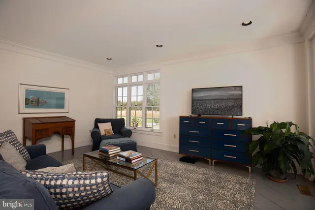 a view of a hallway with seating area