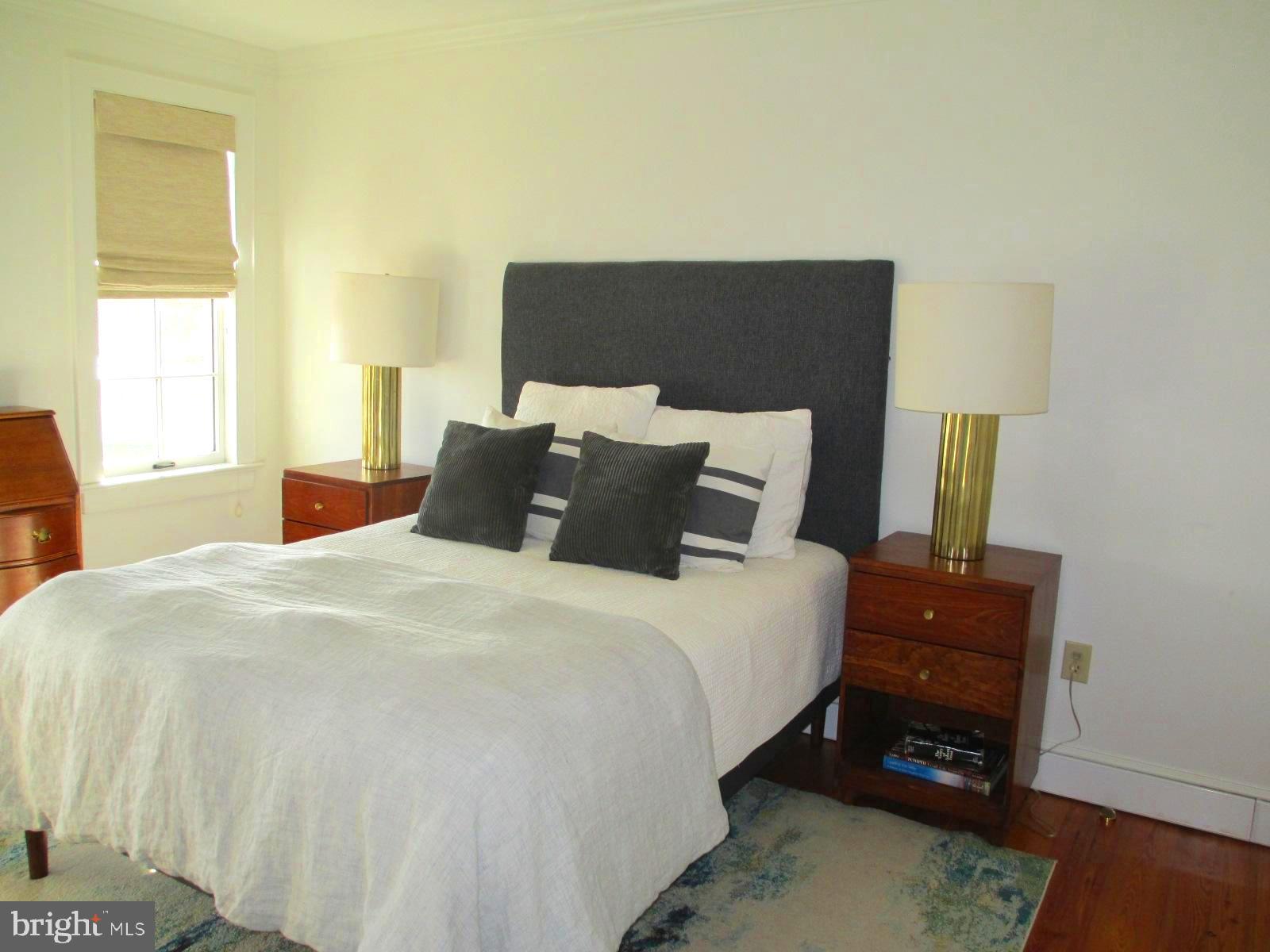 10121 Fairlee Road Chestertown, MD 21620 - Photo 34 of 66 a bedroom with a bed and a dresser