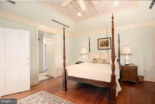 a living room with a fireplace and a rug