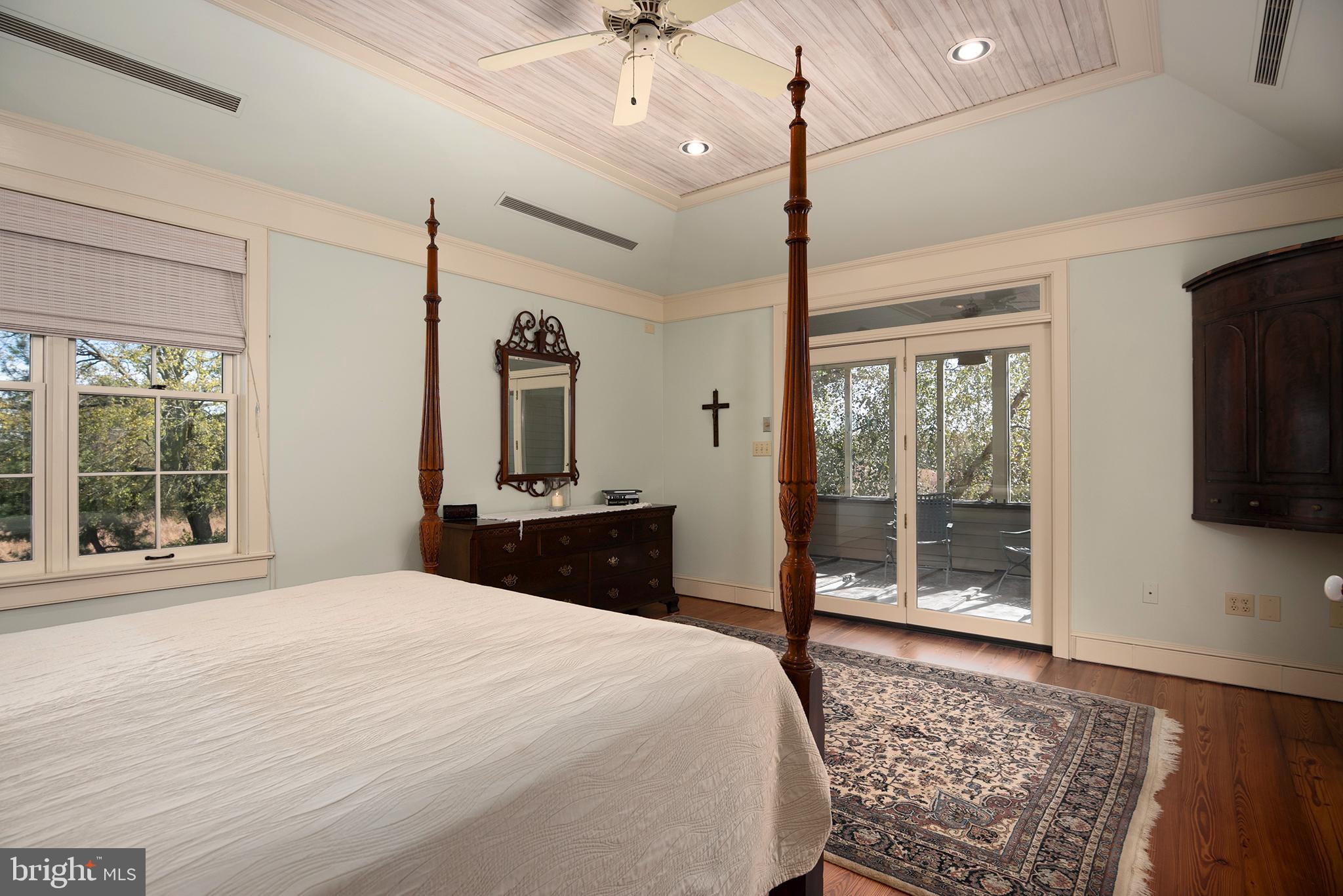 10121 Fairlee Road Chestertown, MD 21620 - Photo 37 of 66 a bedroom with a bed mirror and window