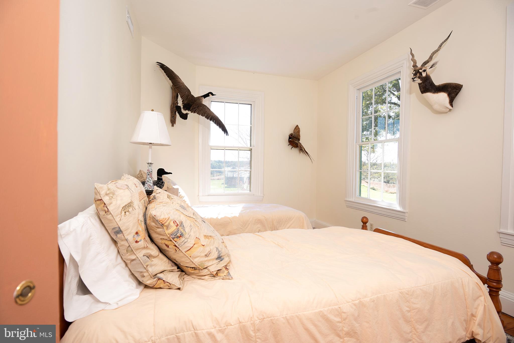 10121 Fairlee Road Chestertown, MD 21620 - Photo 45 of 66 a bedroom with a bed and a window