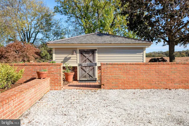 a view of a garden with a house