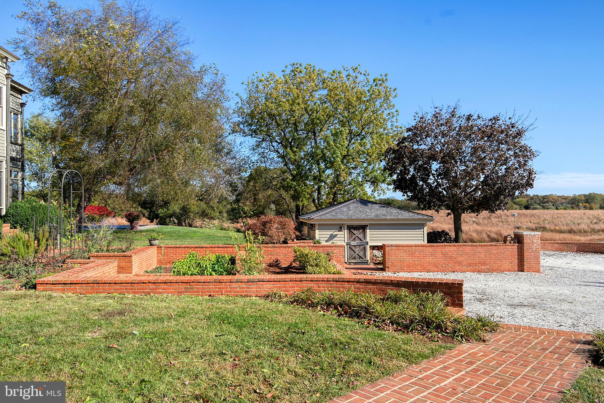 10121 Fairlee Road Chestertown, MD 21620 - Photo 52 of 66 a front view of a house with garden