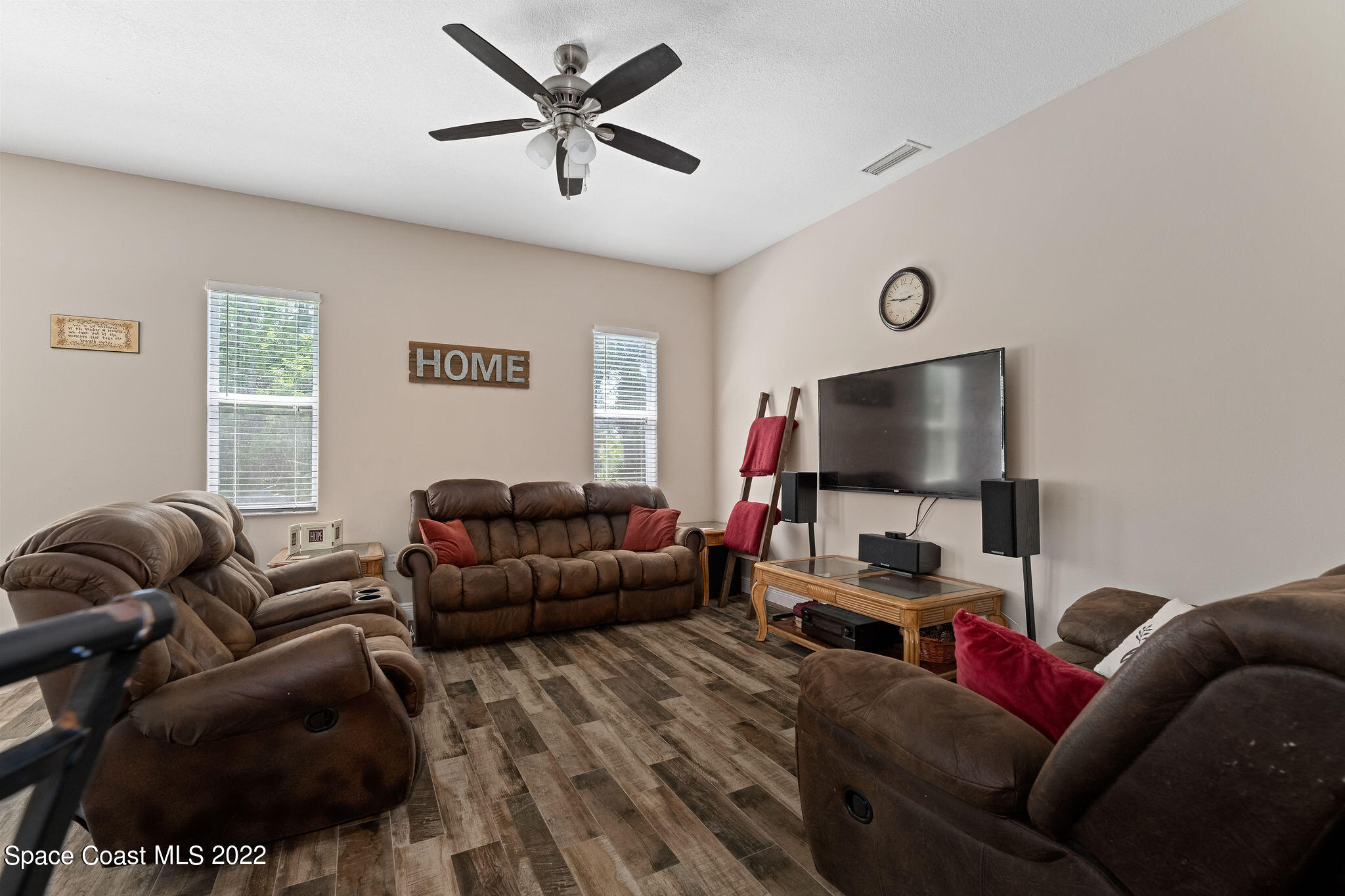 1744 Hydrangea Road Palm Bay, FL 32907 - Photo 18 of 34 a living room with furniture and a flat screen tv
