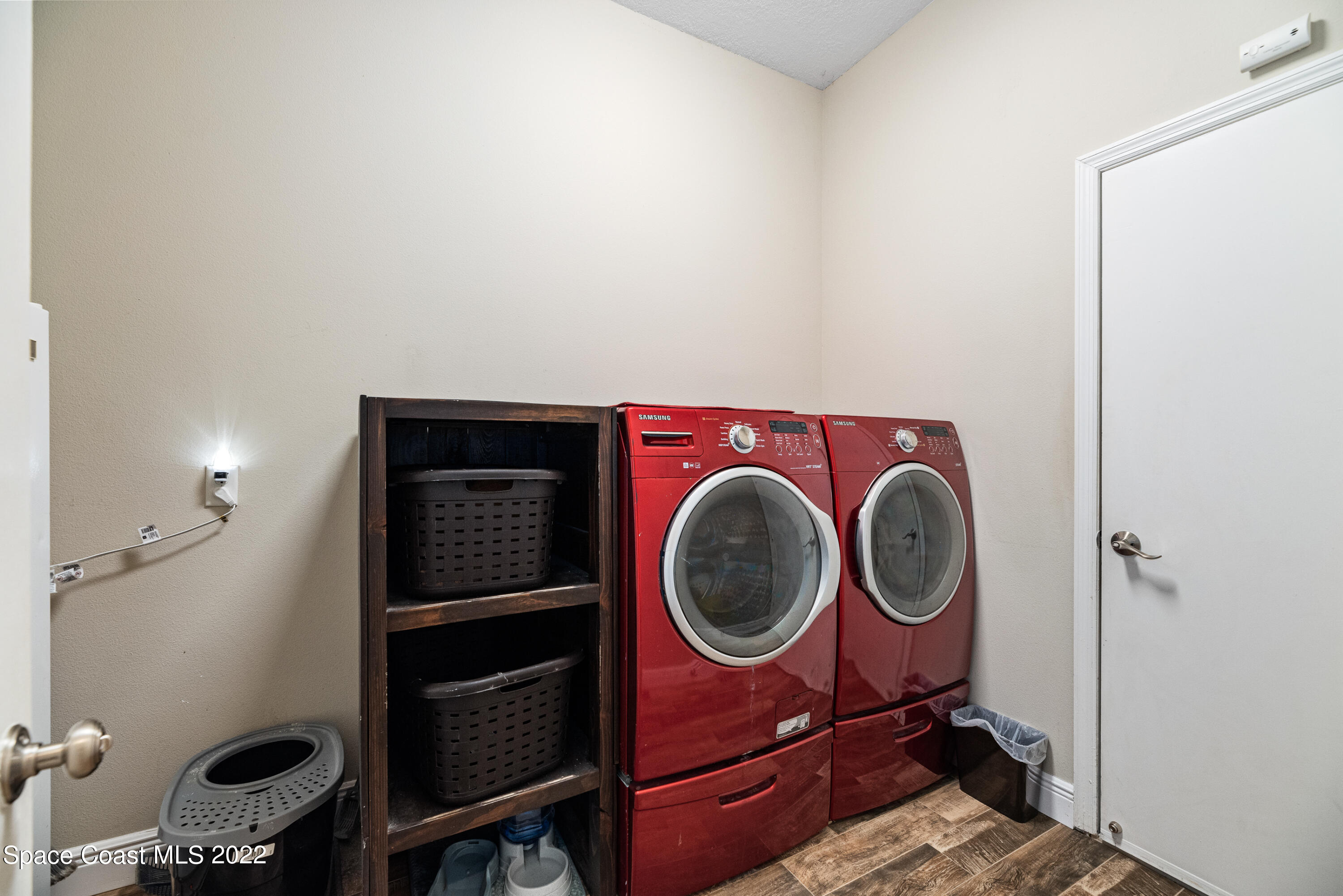 1744 Hydrangea Road Palm Bay, FL 32907 - Photo 20 of 34 a utility room with dryer and washer